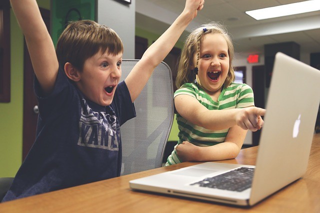 children having fun with a computer