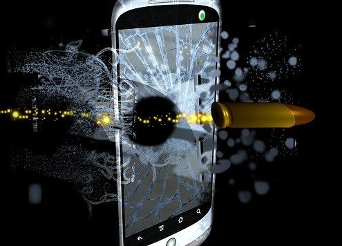 bullet penetrating through your smartphone in a black background