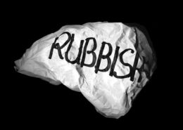 A large pice of white paper crumbled and written "rubbish" in black