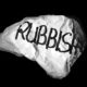A large pice of white paper crumbled and written "rubbish" in black
