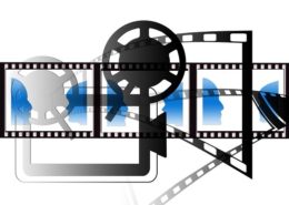 A black and white video icon with blue icons of human faces
