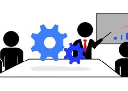 A meeting with business stick men with a blue chart